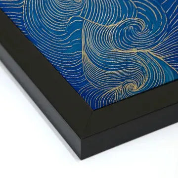 a photo of an abstract wall art painting in a black frame